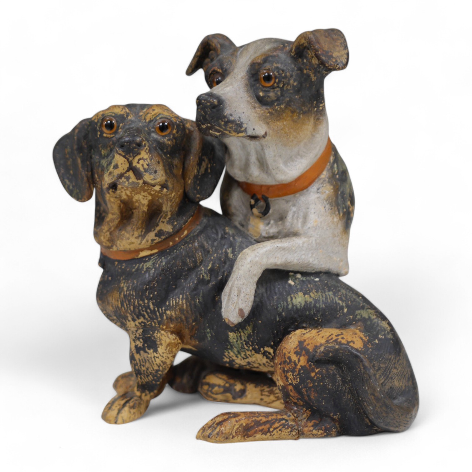 An Austrian cold painted terracotta model of a terrier and dachshund, 19cm high. Condition - one paw broken and reglued some paint worn